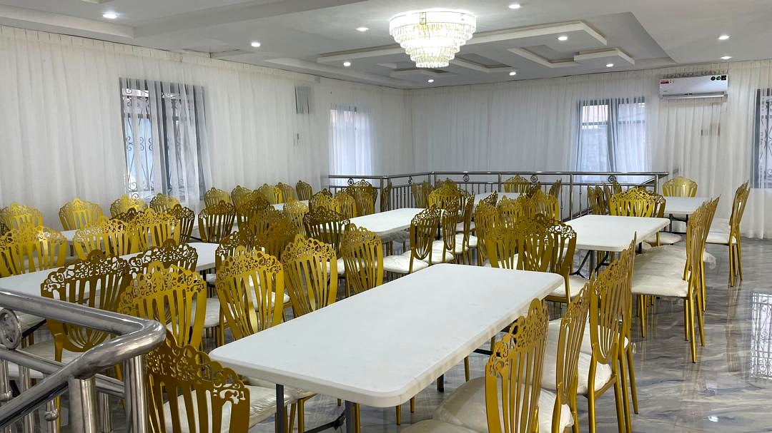 Long tables dressed for a formal dinner